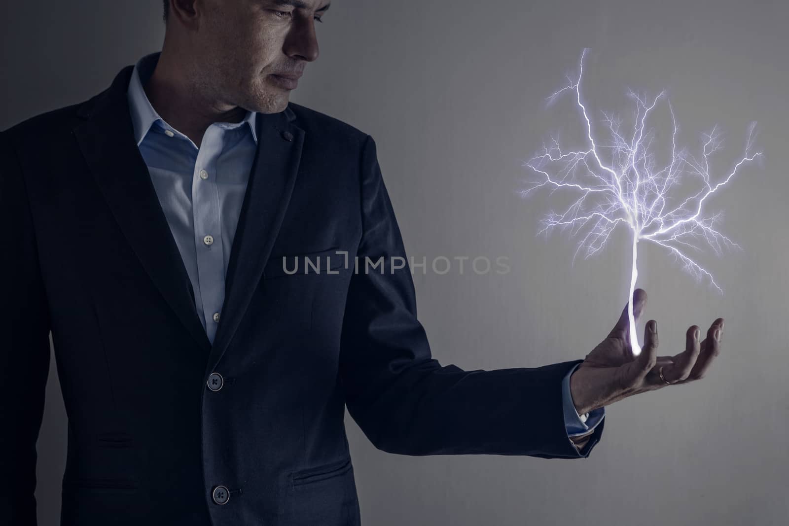 Picture of man holding a lightning strike tree