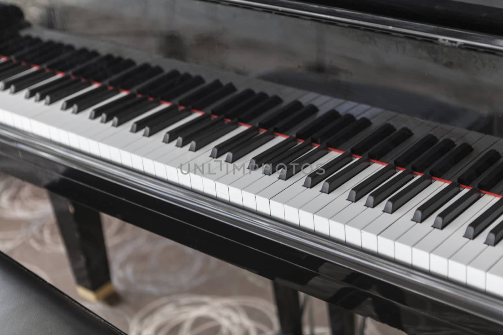 Beautiful picture of a black piano and white keys