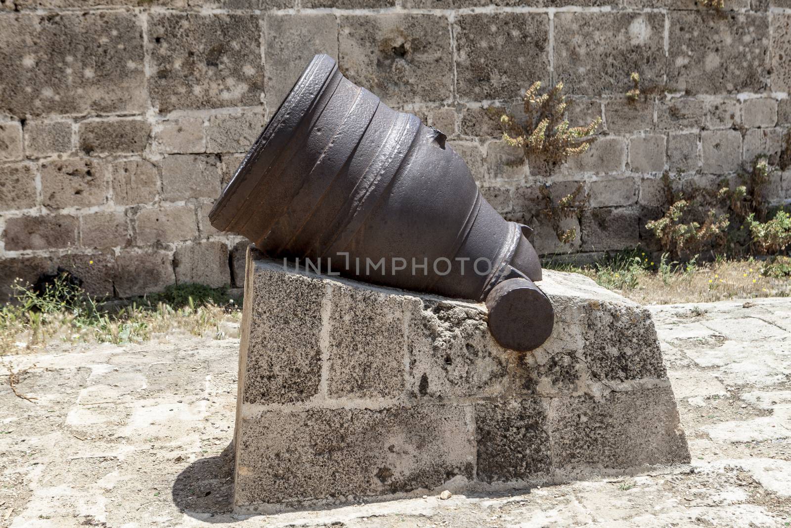 Little cannon on Rock and old walls