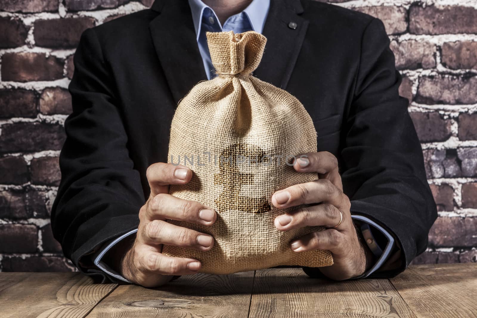 Man holding a big sack of money