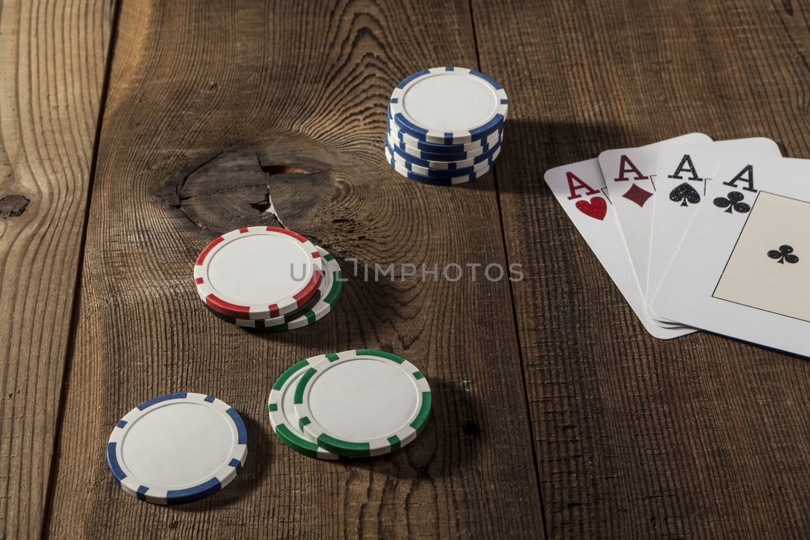 Cards and chips on brown wood table