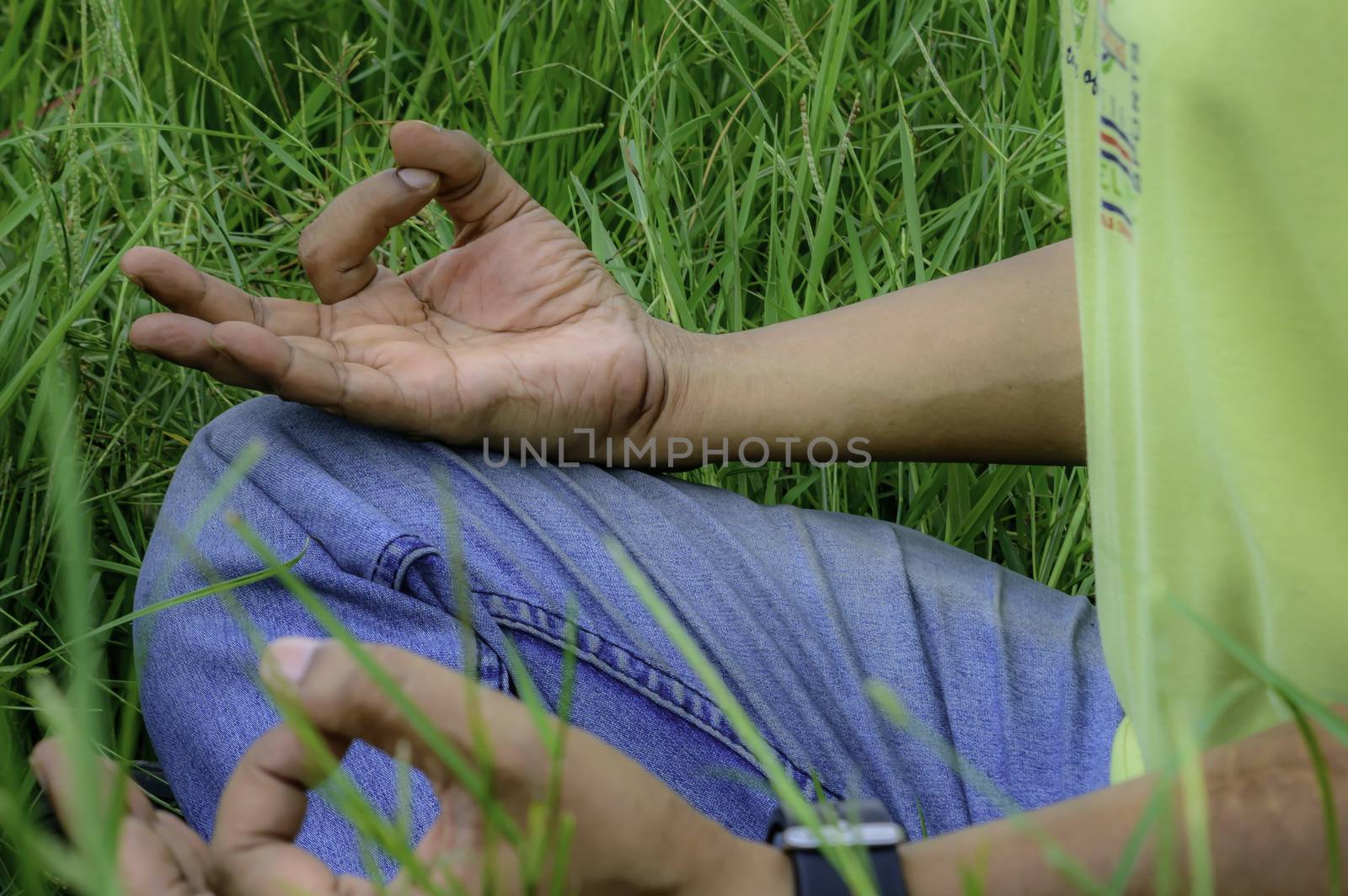 Close up hands, yoga outdoor, exercising vital and meditation for fitness at the nature background. Healthy and Yoga, zen relaxation nature background. Healthy Lifestyle Concept. (Kolkata, India)