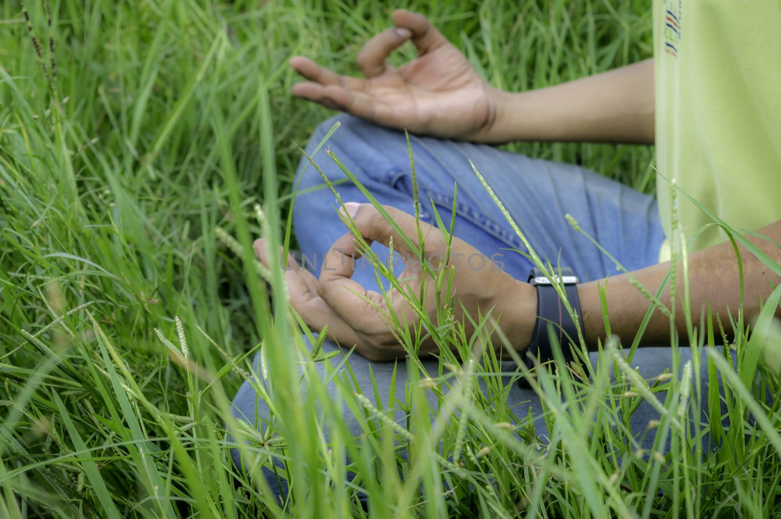 Close up hands, doing yoga outdoor. by sudiptabhowmick