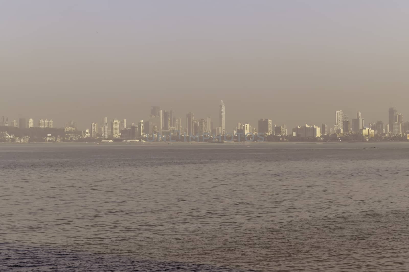 MUMBAI, INDIA - FEBRUARY 25: The Gateway of India, Sky line view Of Marine Drive shot in day light clear sky on a sunny day.