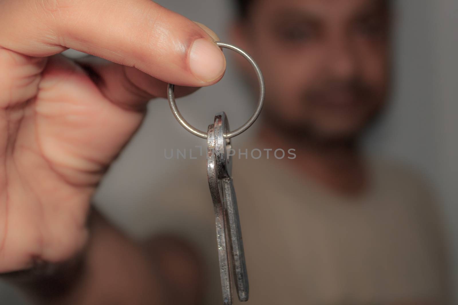 Sales person holding a key by sudiptabhowmick