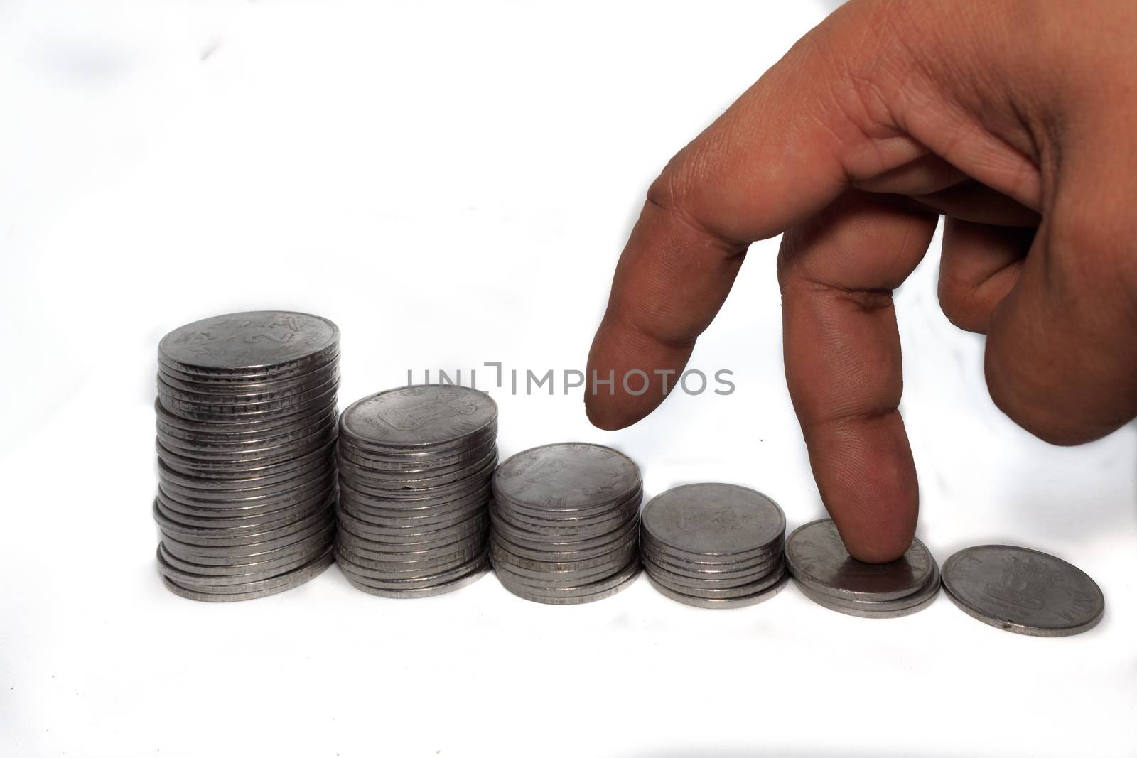 Business man putting fingers on coin and looking for profit growth up, Collecting money with earning bank deposit interest. Business ideas concept isolated white background.