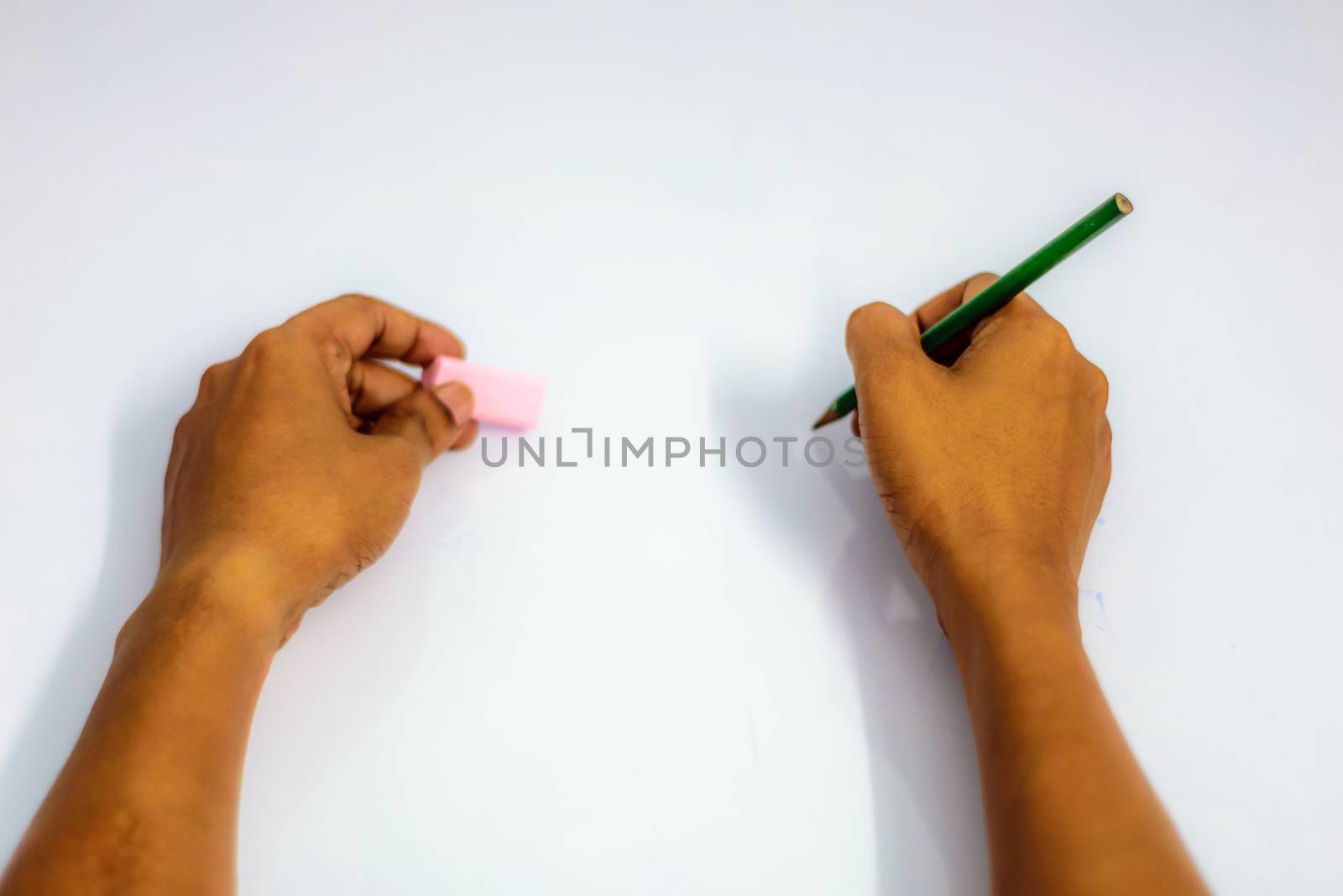 Hand writing virtual thing, isolated on white background. Close up Hand and arm pencil and eraser. Can use for Show your product presentation. Female hand explaining pointing writing doing something