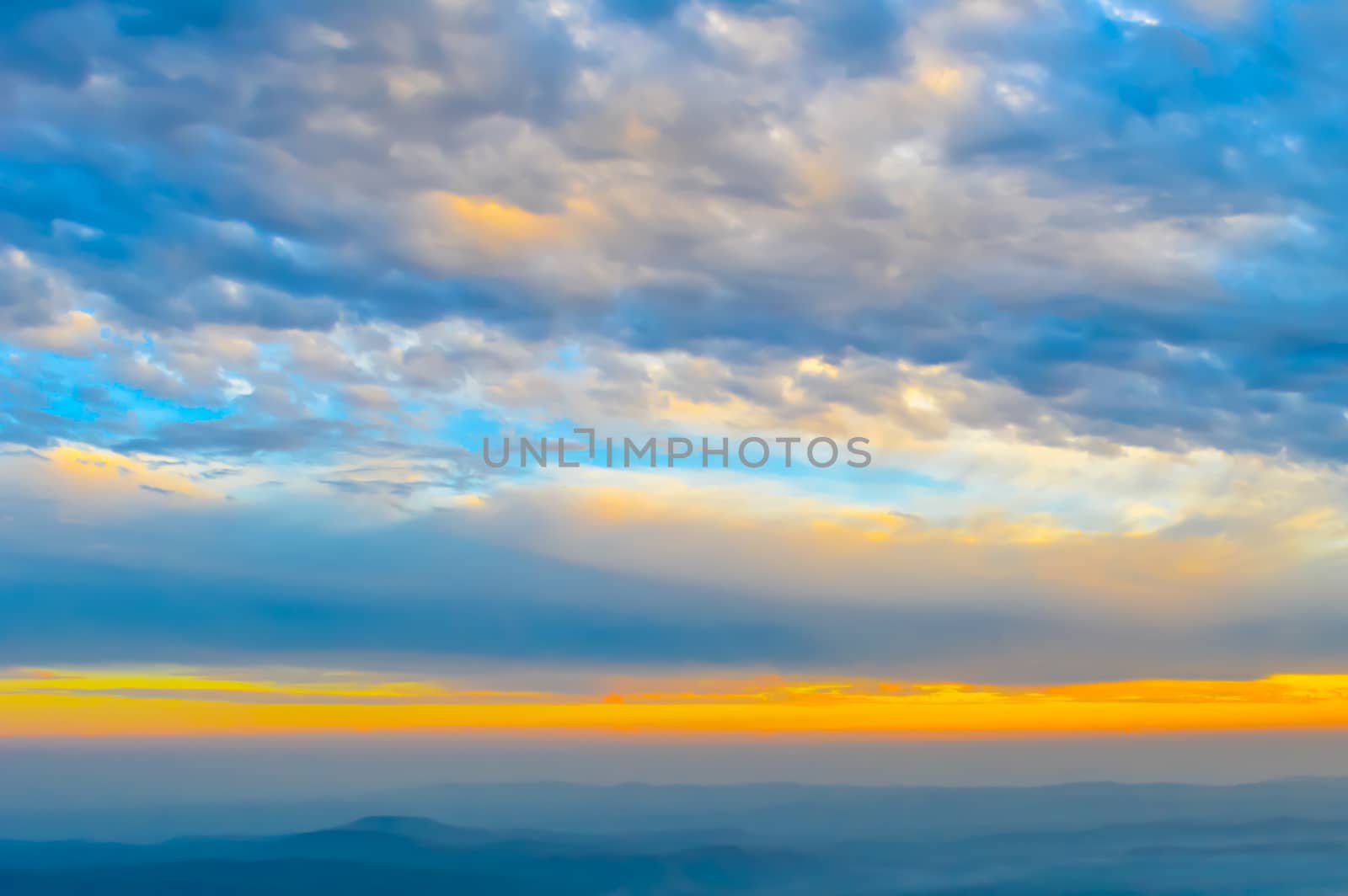 Vibrant color cloud scape on a dramatic sky. Image was captured on a sunny summer day in sunset time. Outdoor travel photography. (Hill station of Darjeeling, West Bengal, India)