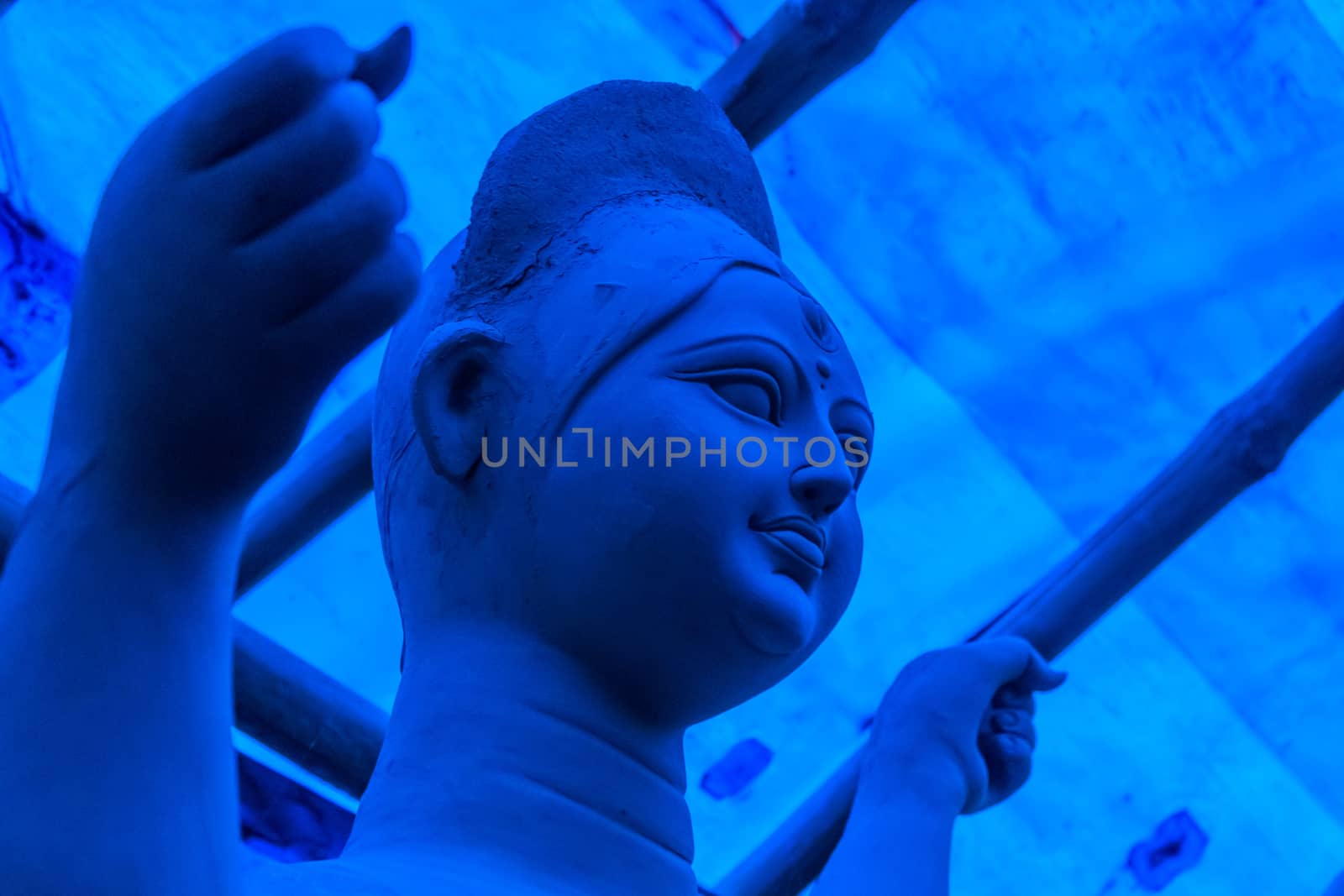 Handmade clay model of "Maa Durga" or " Devi Durga"- Hindu woman Idol close up. Snapped in the beginning of city famous Bengali festival of Kolkata or Calcutta, West Bengal, India, Asia