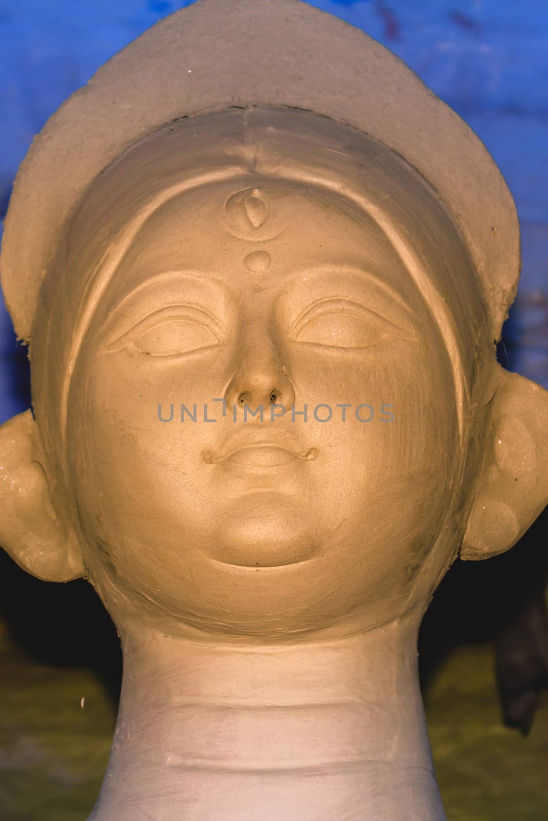 Handmade clay model of "Maa Durga" or " Devi Durga"- Hindu woman Idol close up. Snapped in the beginning of city famous Bengali festival of Kolkata or Calcutta, West Bengal, India, Asia