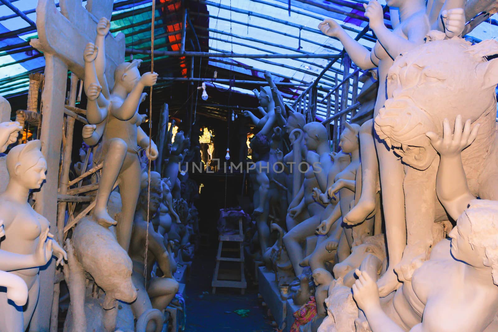 Handmade clay model of "Maa Durga" or " Devi Durga"- Hindu woman Idol. Snapped in the beginning of city famous Bengali festival of Kolkata or Calcutta, West Bengal, India, Asia