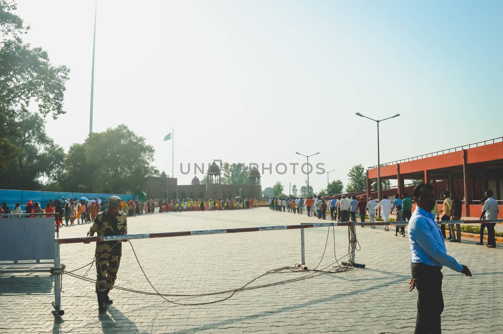 WAGHA BORDER, AMRITSAR, PUNJAB, INDIA - JUNE, 2017. People going to attend lowering of flags ceremony. Its a daily military practice security forces of India and Pakistan jointly followed since 1959. by sudiptabhowmick