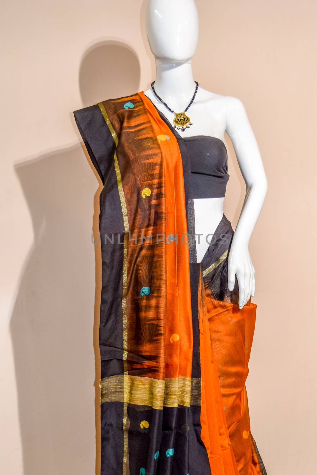 A traditional indian silk saree displayed for sale by sudiptabhowmick