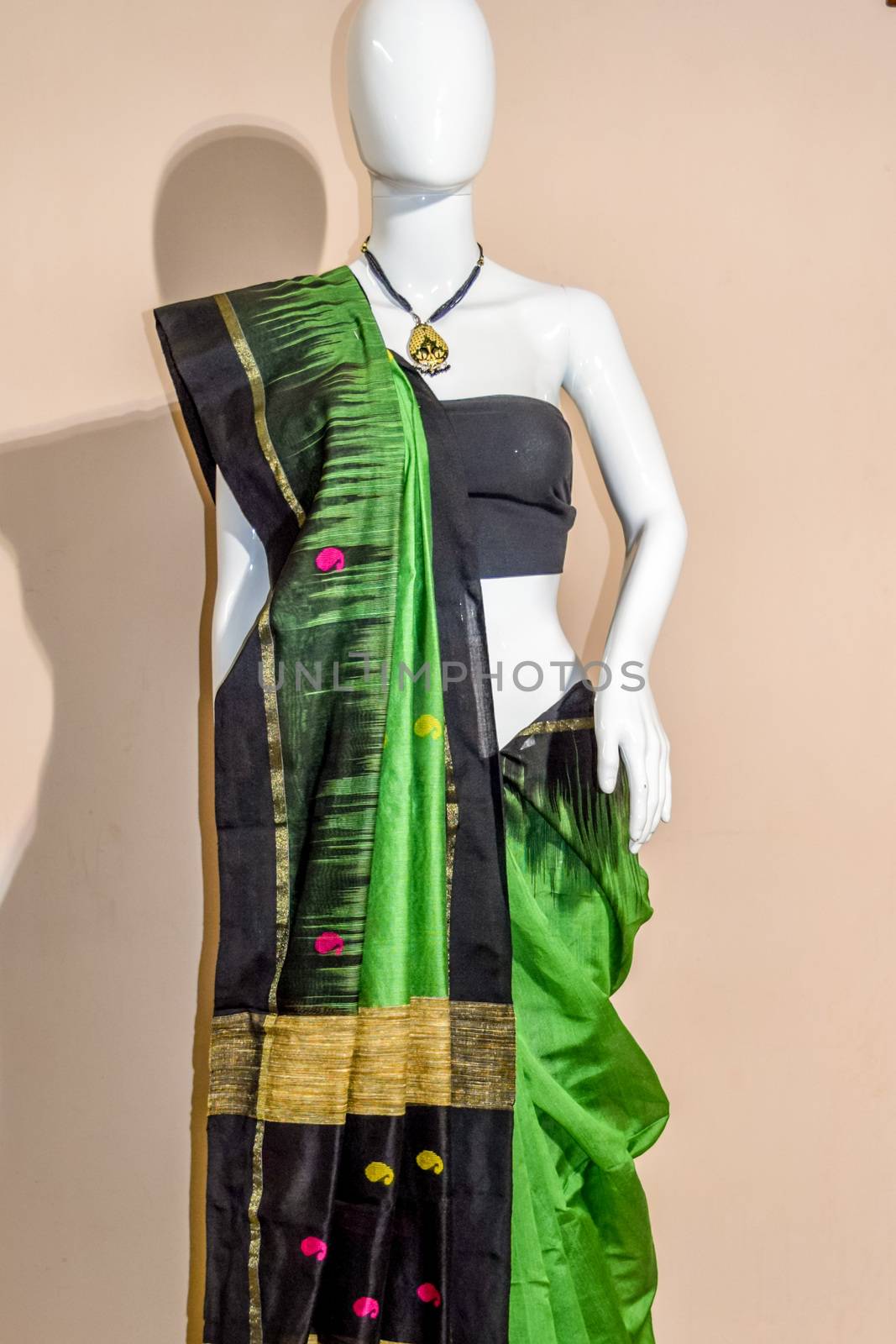 A traditional indian silk saree displayed for sale by sudiptabhowmick