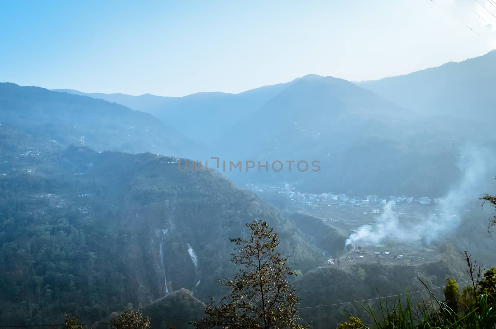 In the jungle to top mountains. Aerial, panoramic view of a forest in the mountains on a foggy day with copy space. Manali, Himachal Pradesh, India