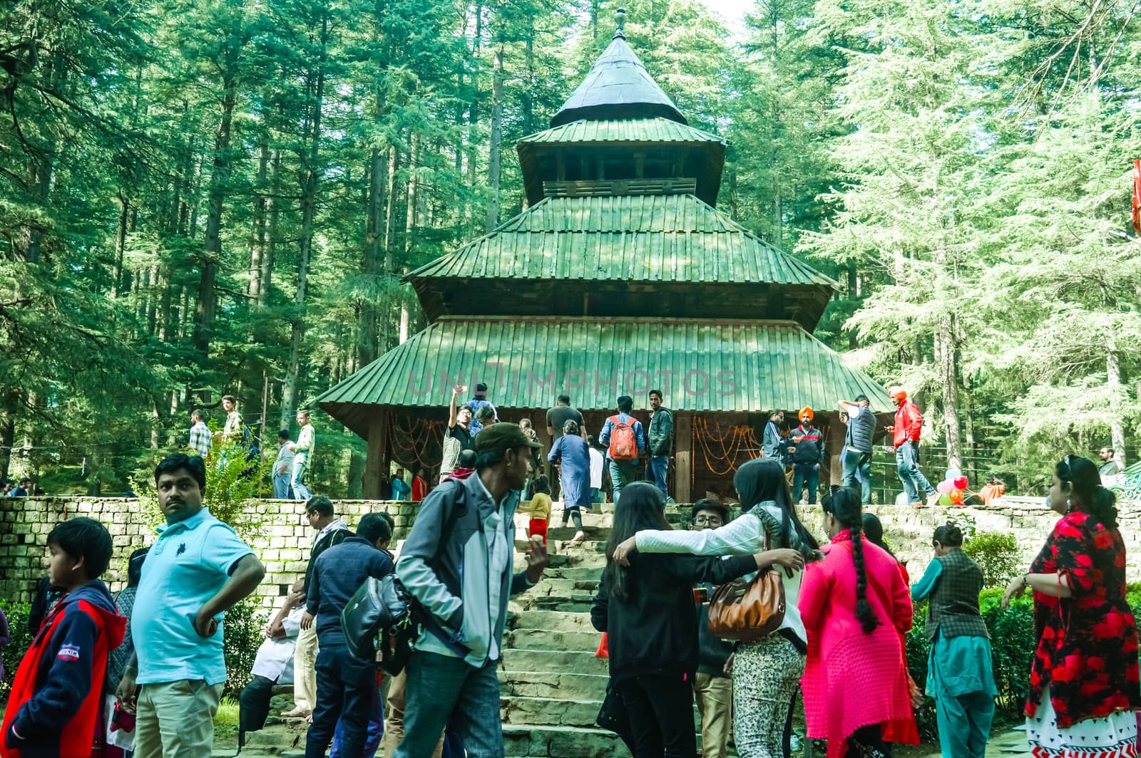 MANALI, INDIA - DECEMBER 9 Tourist come See the sacred Hidimda Devi Temple in Shimla, Kullu, Himachal Pradesh, noerthern India, Asia. Famous view of wooden covered architecture of Himalayan region.