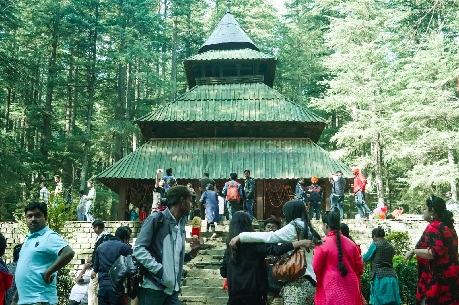 MANALI, INDIA - DECEMBER 9 Tourist come See the sacred Hidimda Devi Temple in Shimla, Kullu, Himachal Pradesh, noerthern India, Asia. Famous view of wooden covered architecture of Himalayan region.