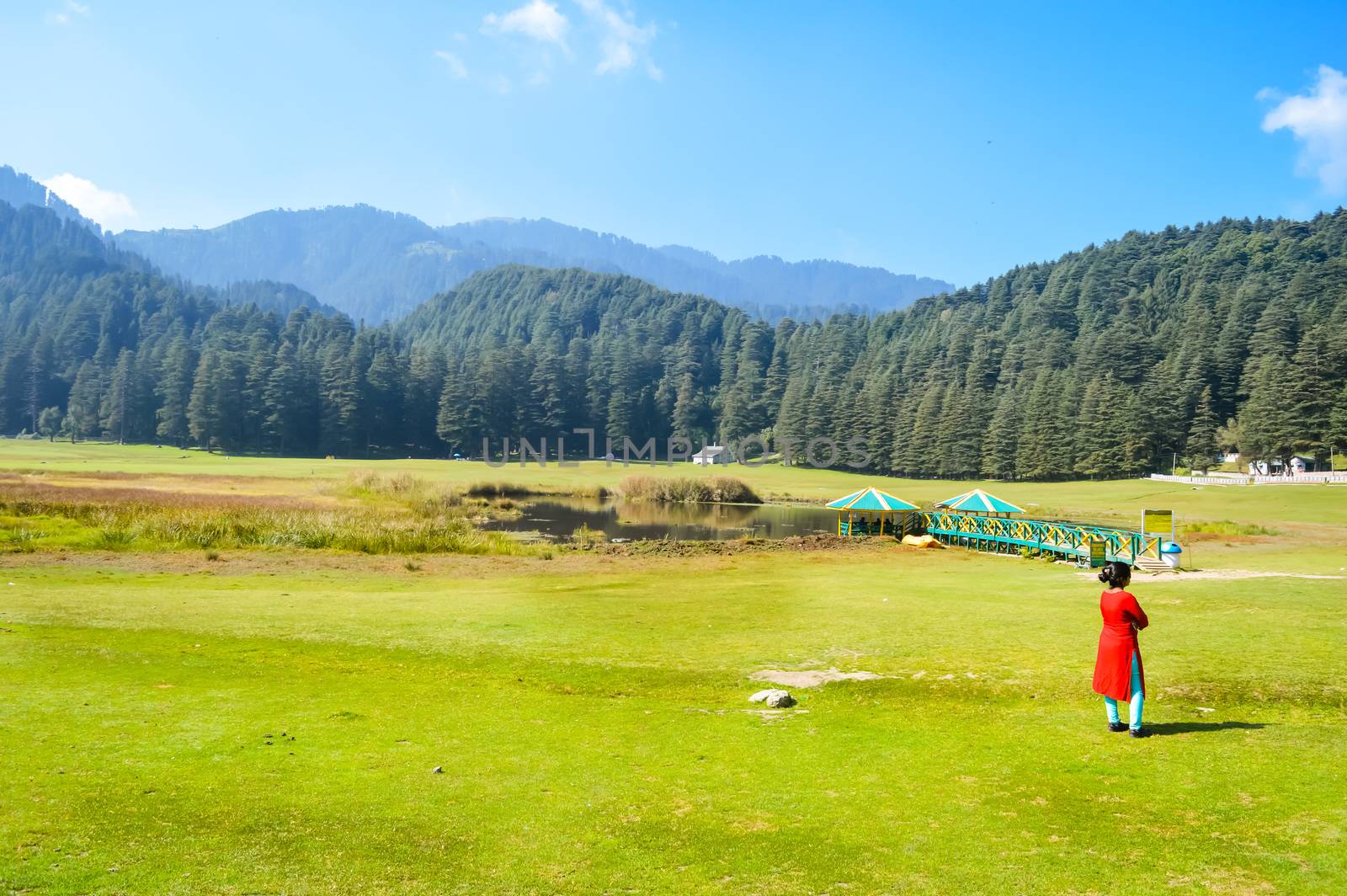 A lady standing and relaxing on Himalayan valley of "DALHOUSIE KULLU", JAMMU AND KASHMIR, HIMACHAL PRADESH, INDIA, ASIA. Famous for Golf course and outdoor activities. Indian sports concept
