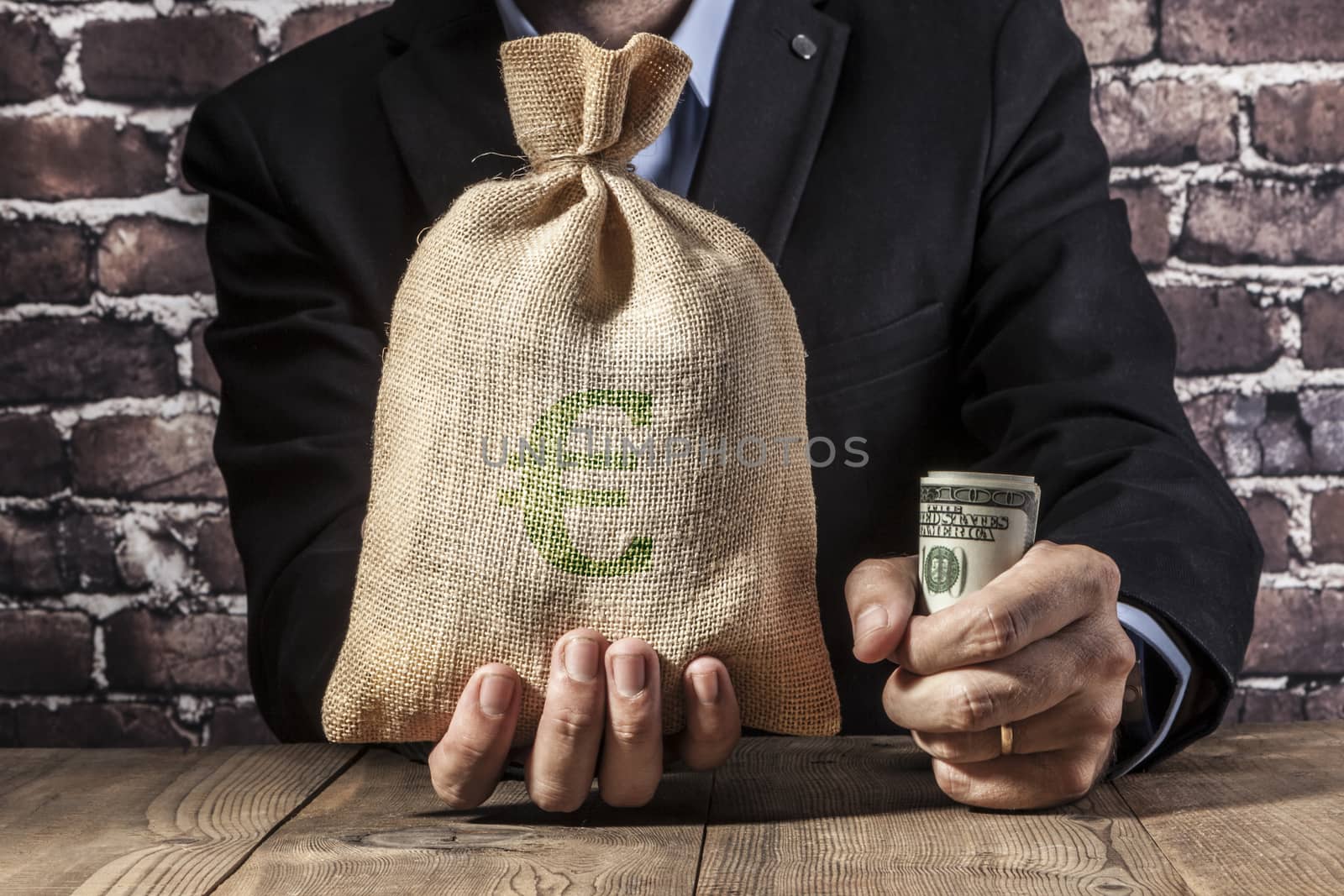 Man holding a big sack of money