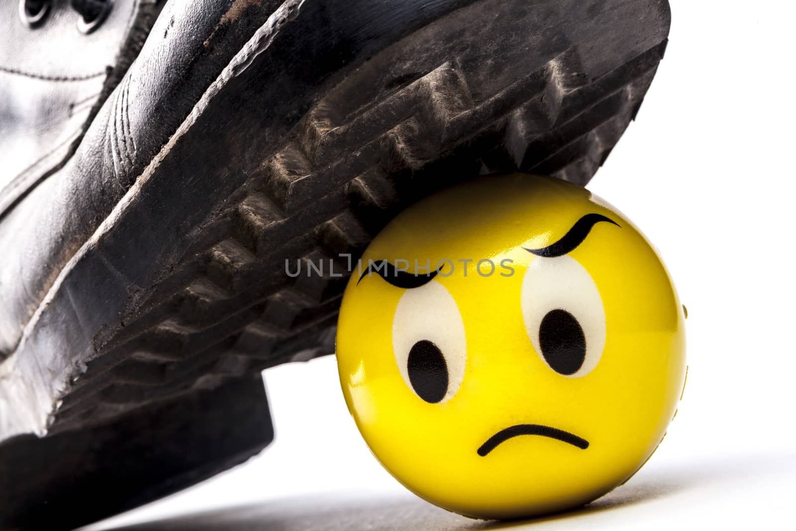 Army boot and emoticon isolated on white background with shadow