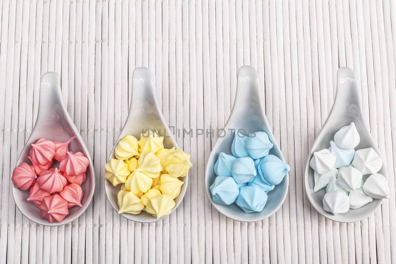Yummy sweet stuff in colours on white wood