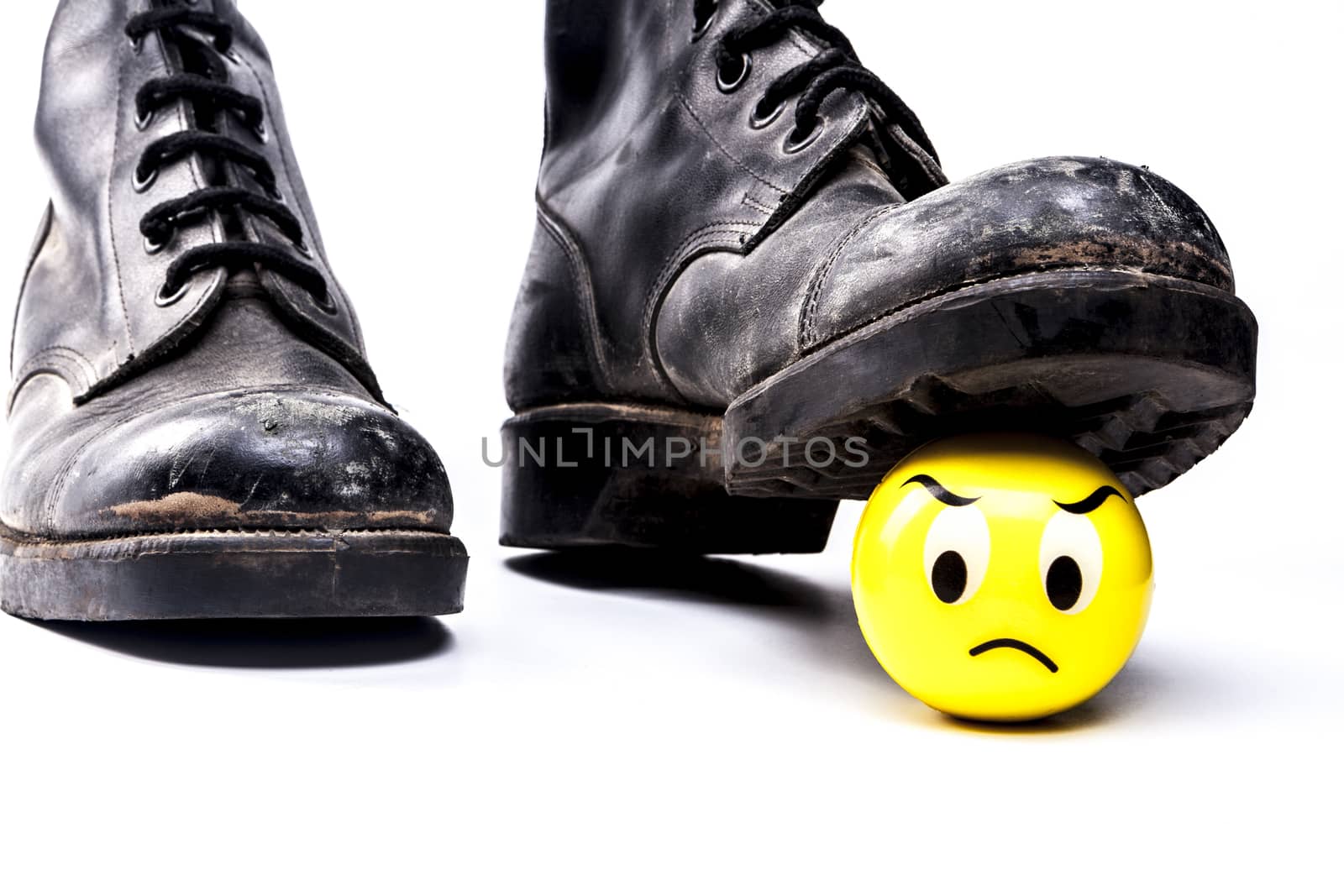 Army boots and emoticon isolated on white background with shadow