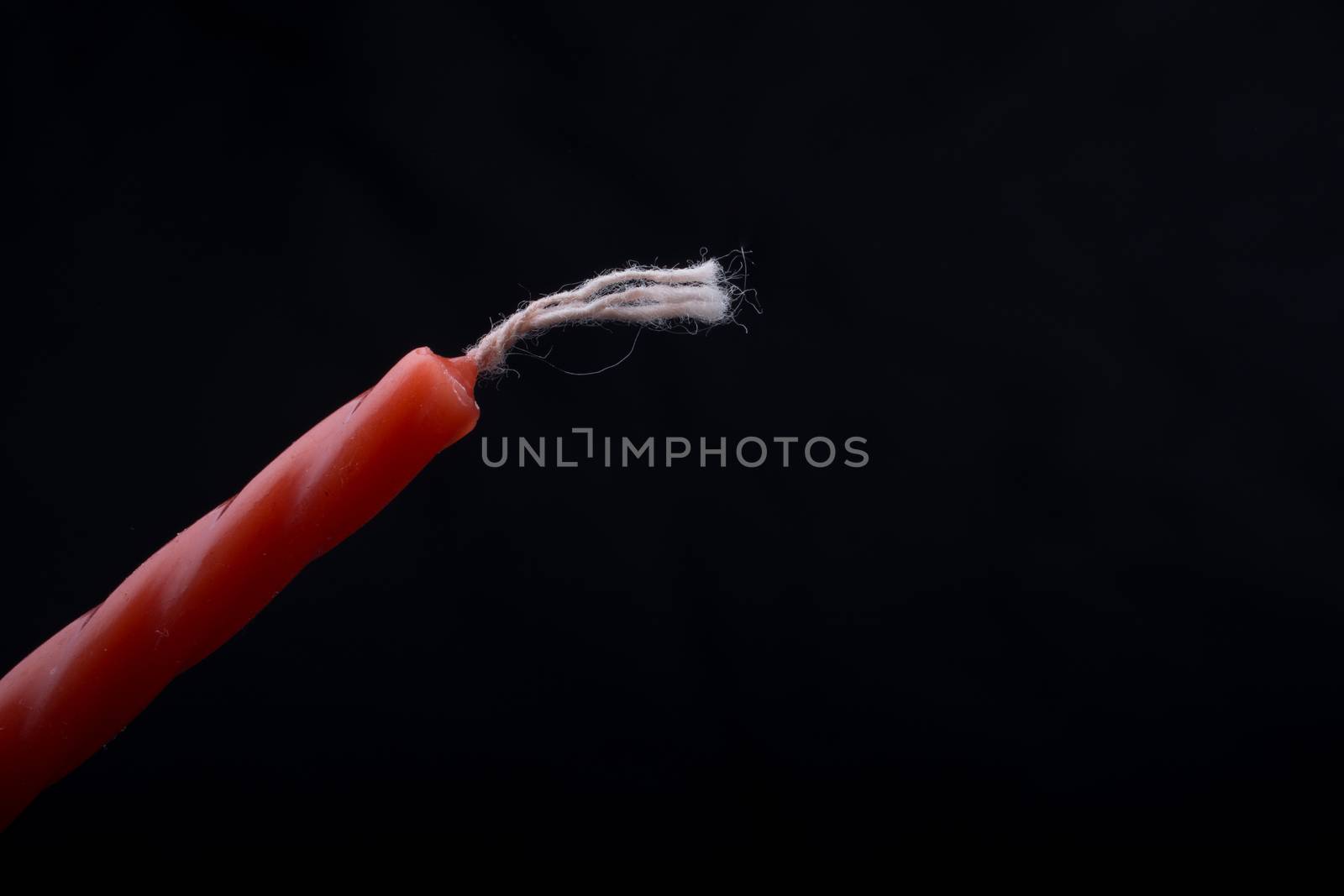 Colorful candle  on a black background