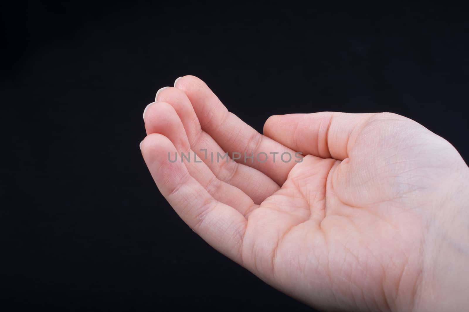 Five  fingers of a human hand partly seen in view by berkay