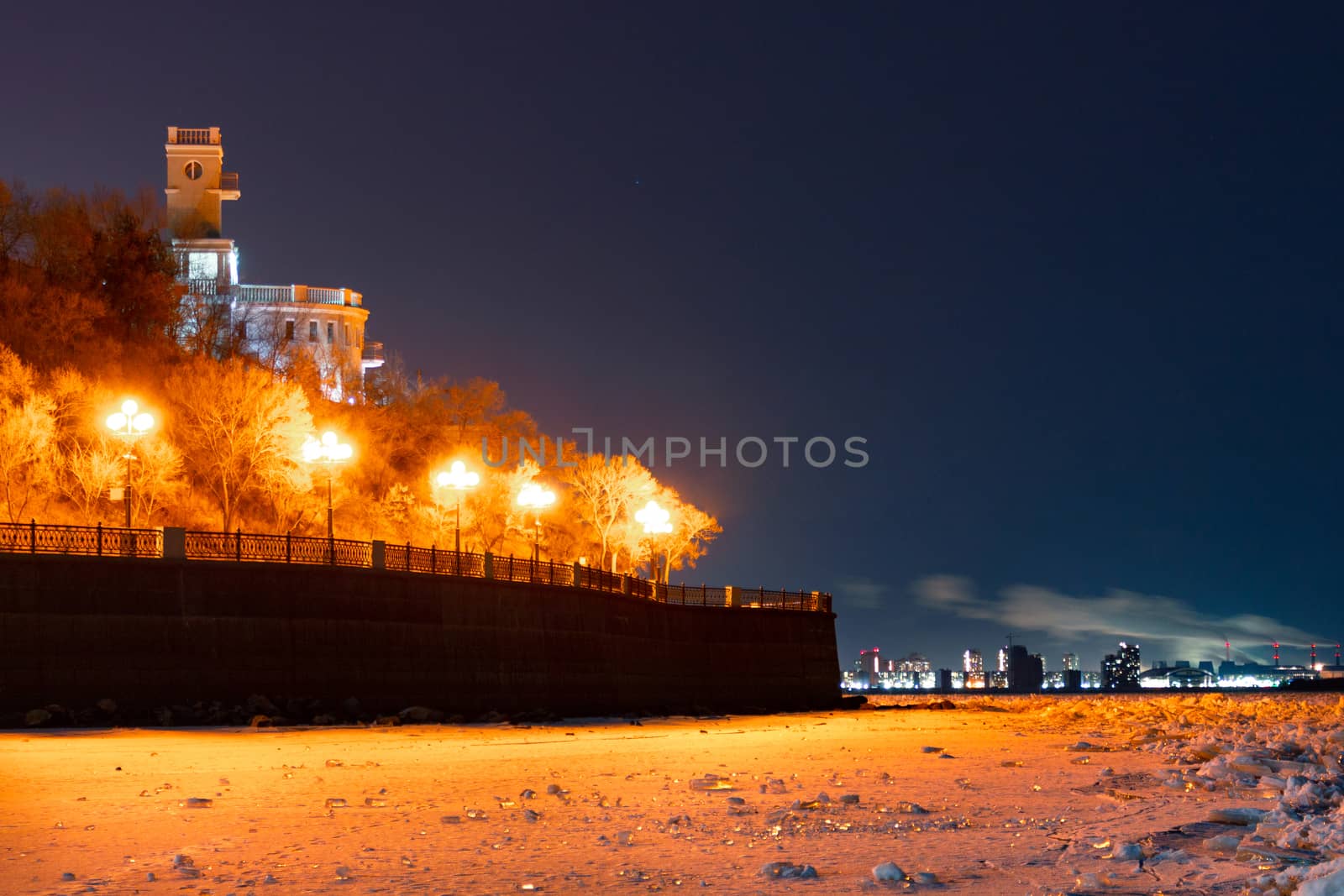 Evening view of the city of Khabarovsk in the winter. The ice on the Amur river.