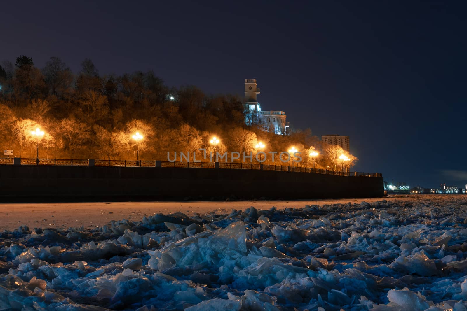 Evening view of the city of Khabarovsk in the winter. The ice on the Amur river.