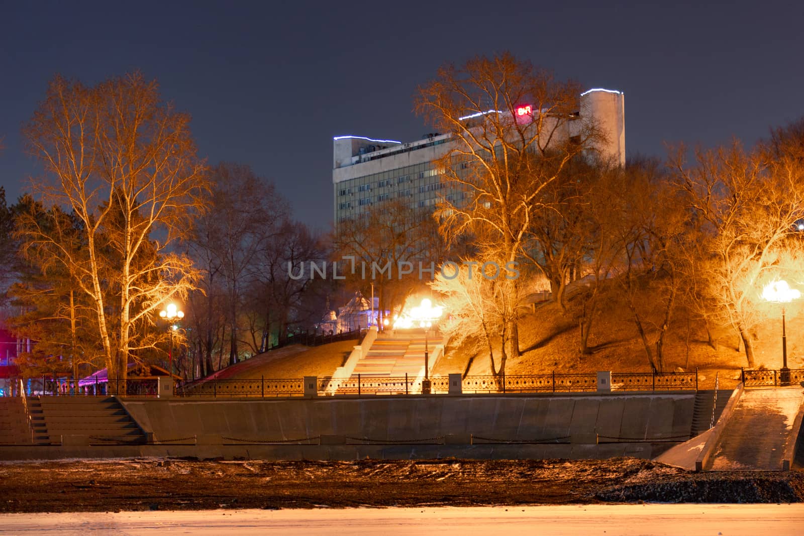 Evening view of the city of Khabarovsk in the winter. The ice on the Amur river.