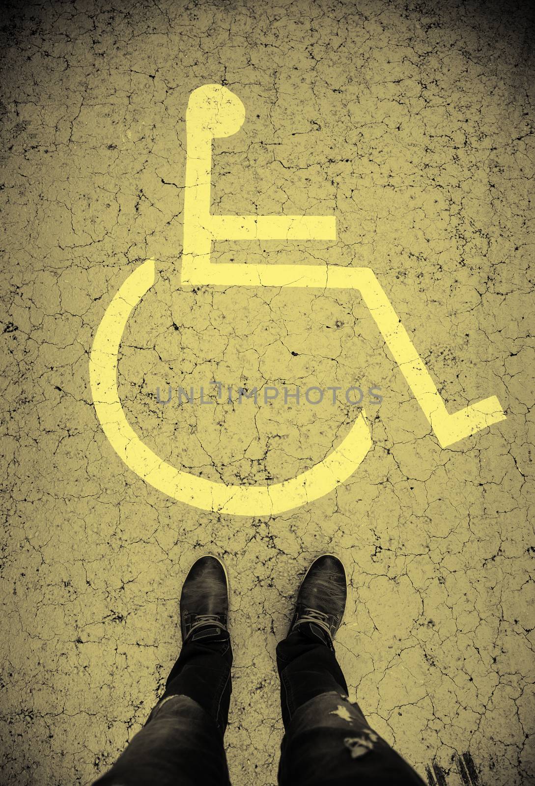 Disabled sign on the asphalt, access detail for the disabled