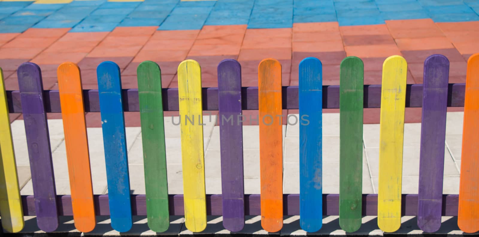 Close up of a part of decorative colorful wooden fence