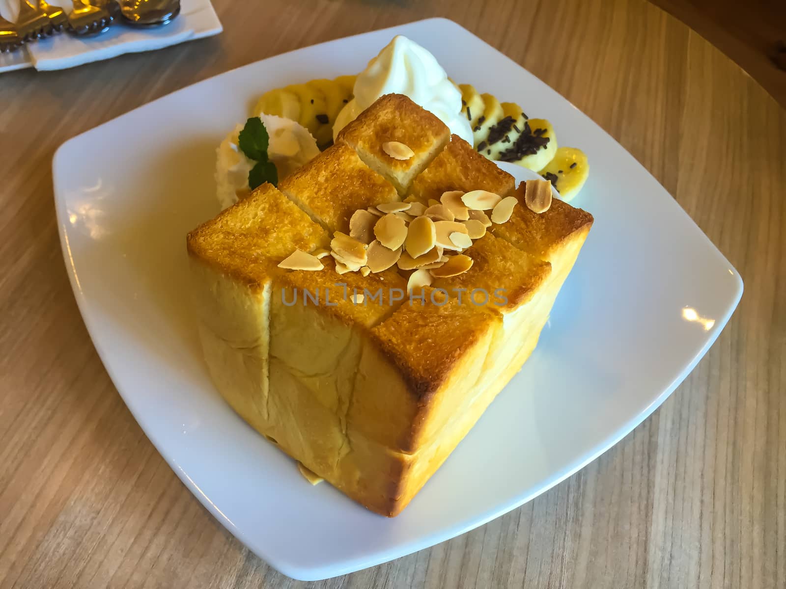 Ice cream dessert on the wooden table in a coffee cafe.