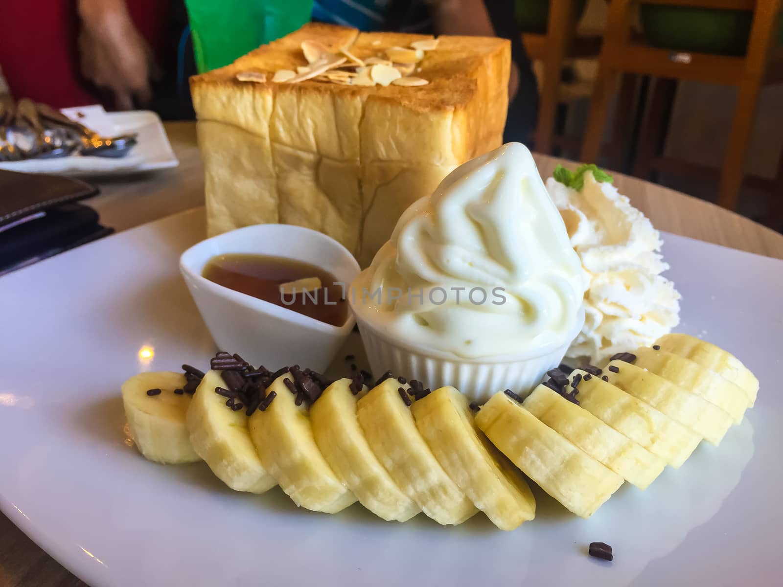 Ice cream dessert on the wooden table in a coffee cafe.