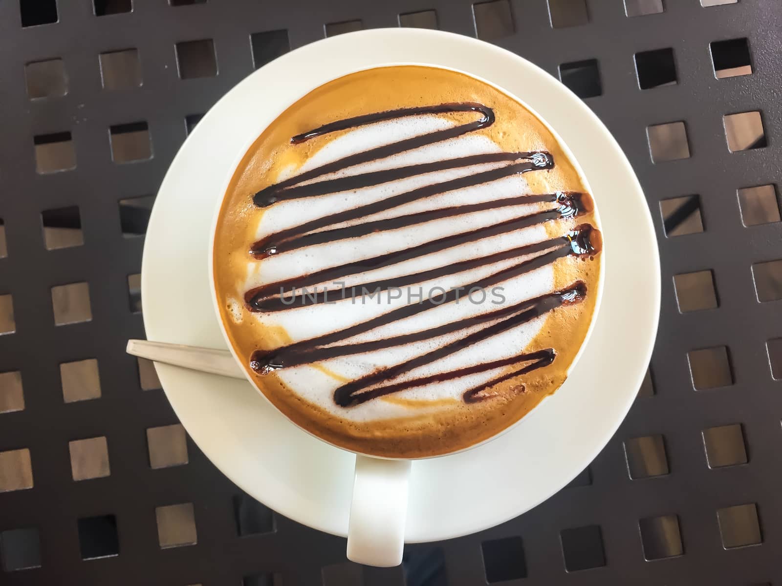 Hot coffee in white cup on the  table.