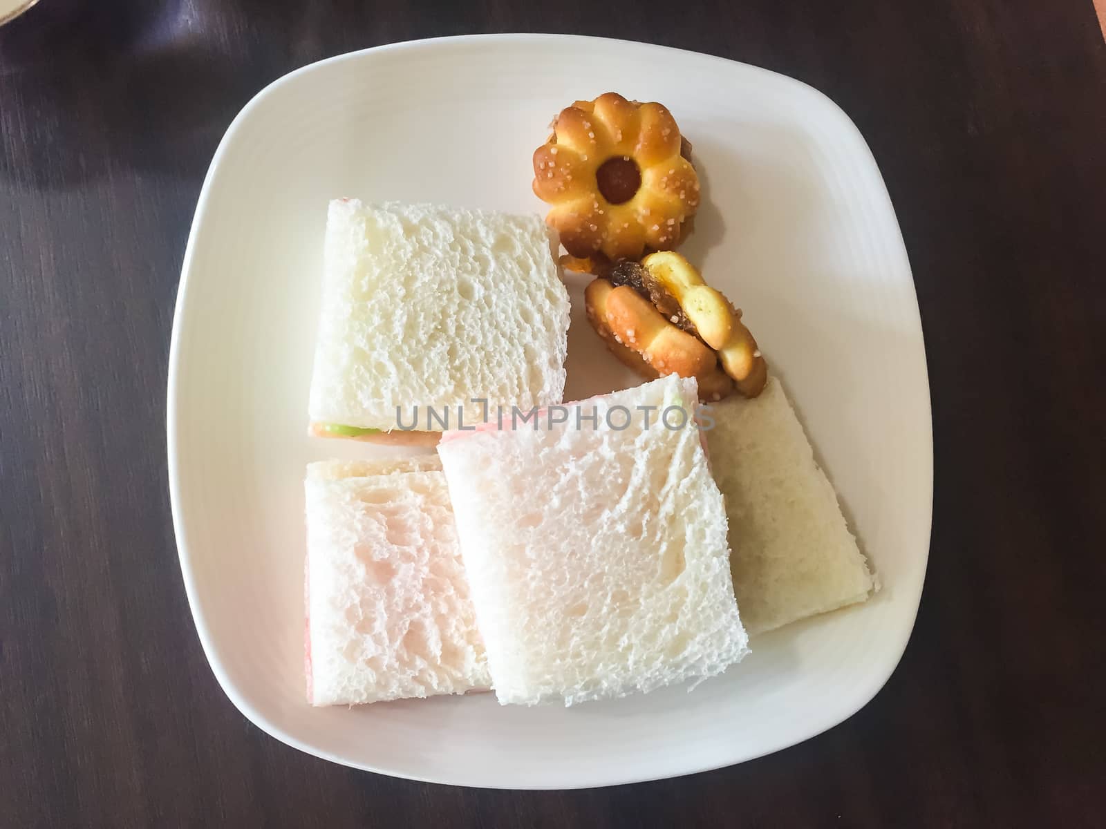 Slice of bread on a wooden table.