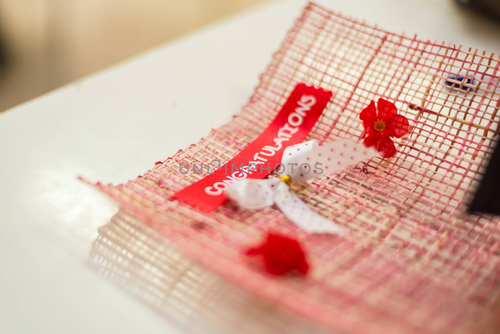 Congratulations message stuck on the bouquet.