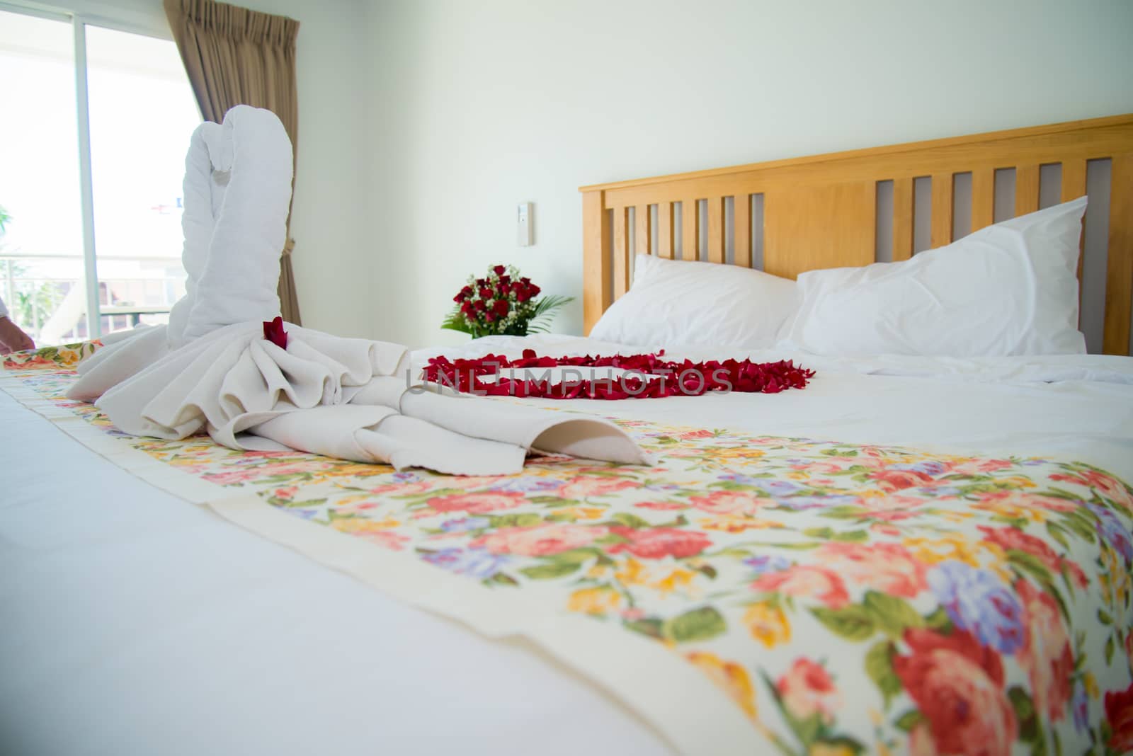 Roses placed on the the bed in wedding day. bridal house