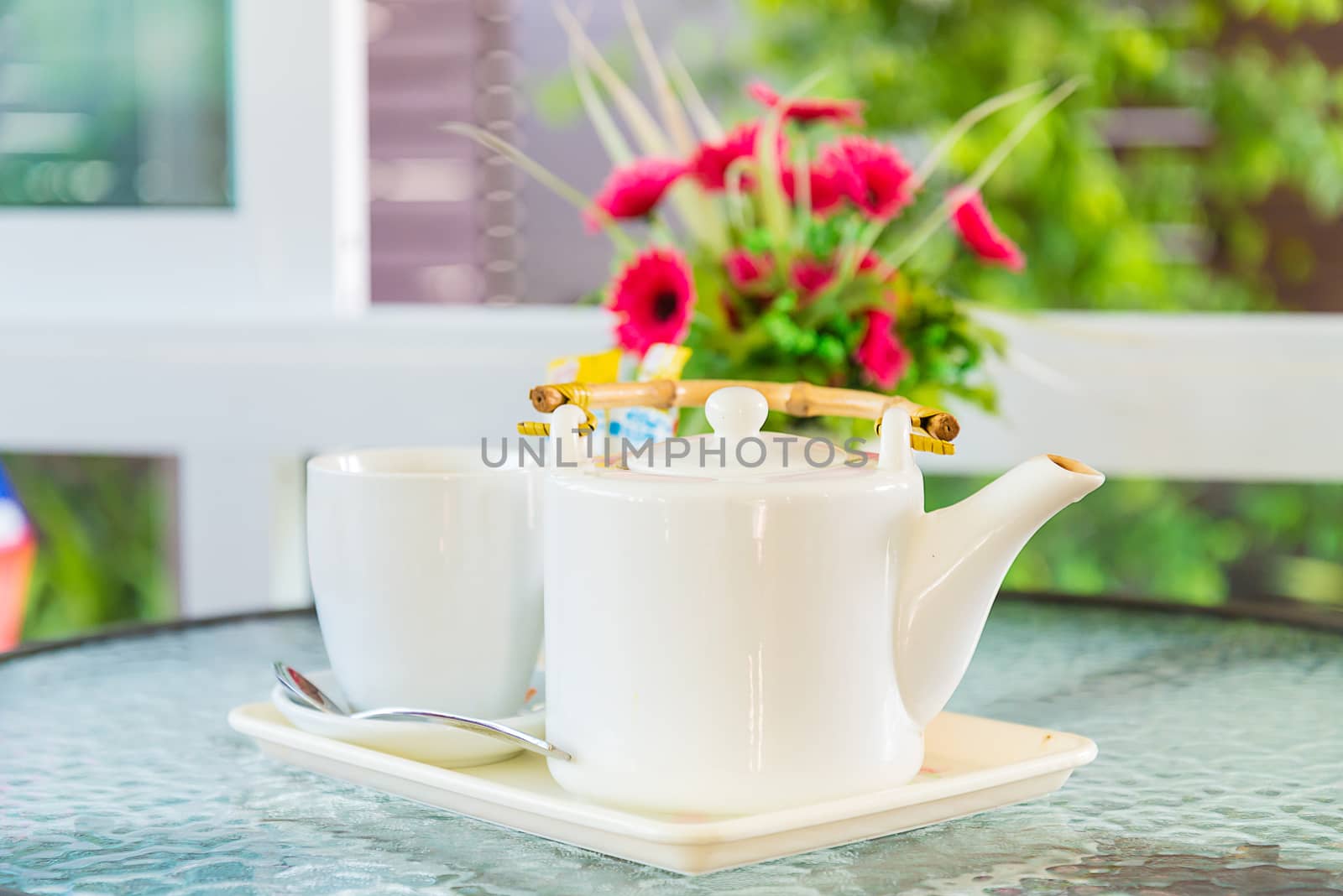 Hot coffee and a teapot on the table.