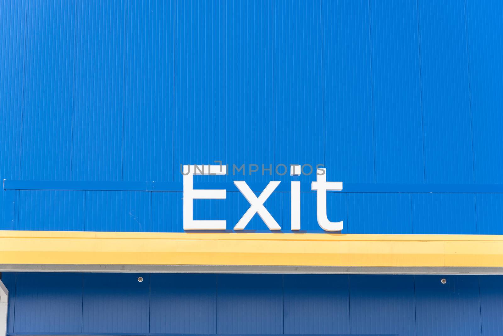 Exit sign close-up on blue background by trongnguyen