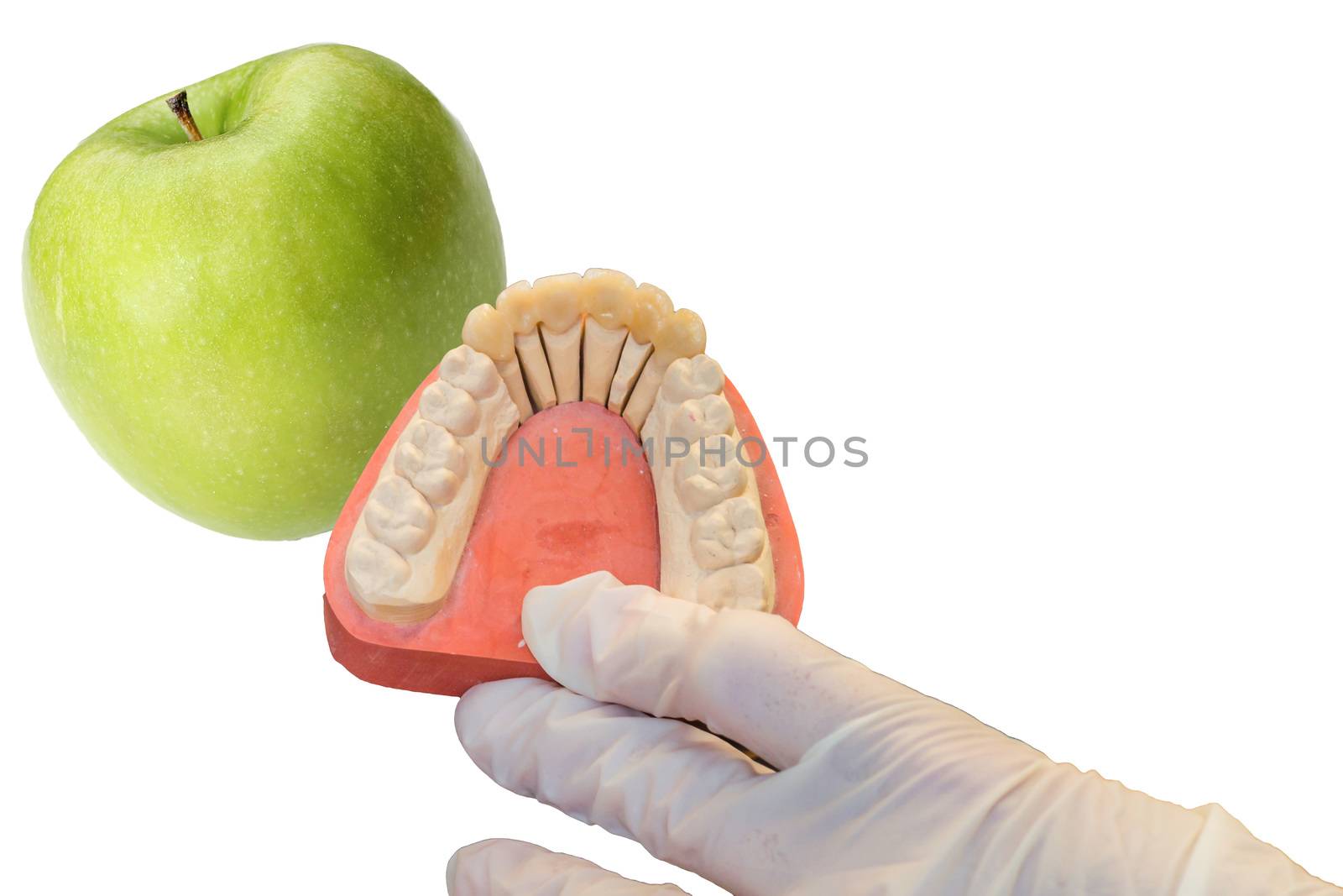 Dentures and apple on white background by JFsPic