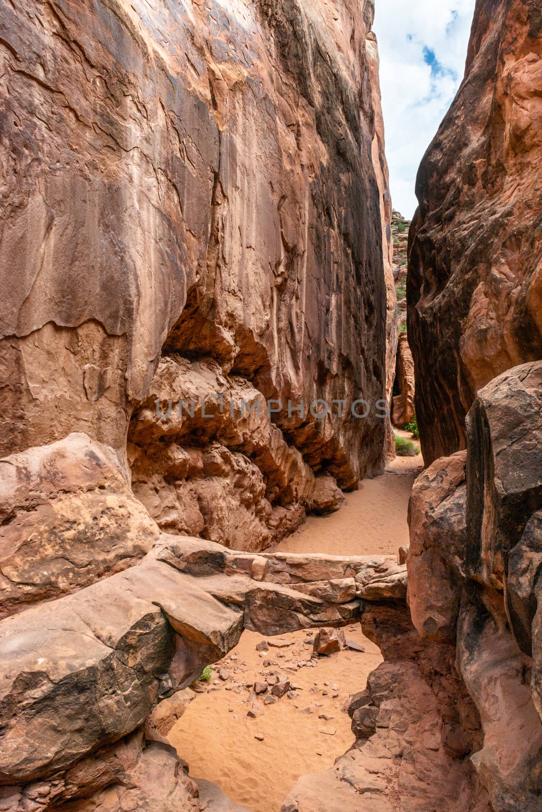 Sandstone bridge in a slot canyon in Fiery Furnace, Arches National Park, Utah
