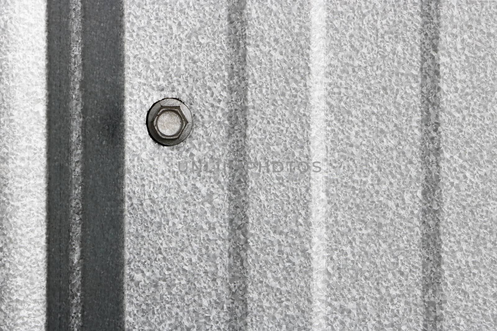Texture of fitting bolt on wall metal sheet, abstract background