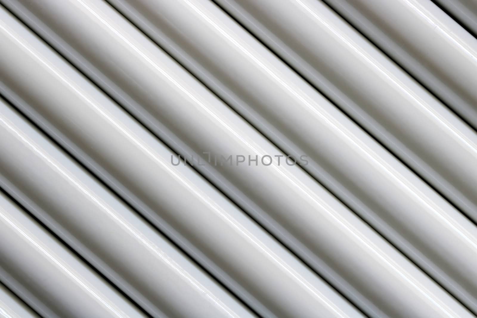 Texture of white steel pipe sort in diagonal, abstract background