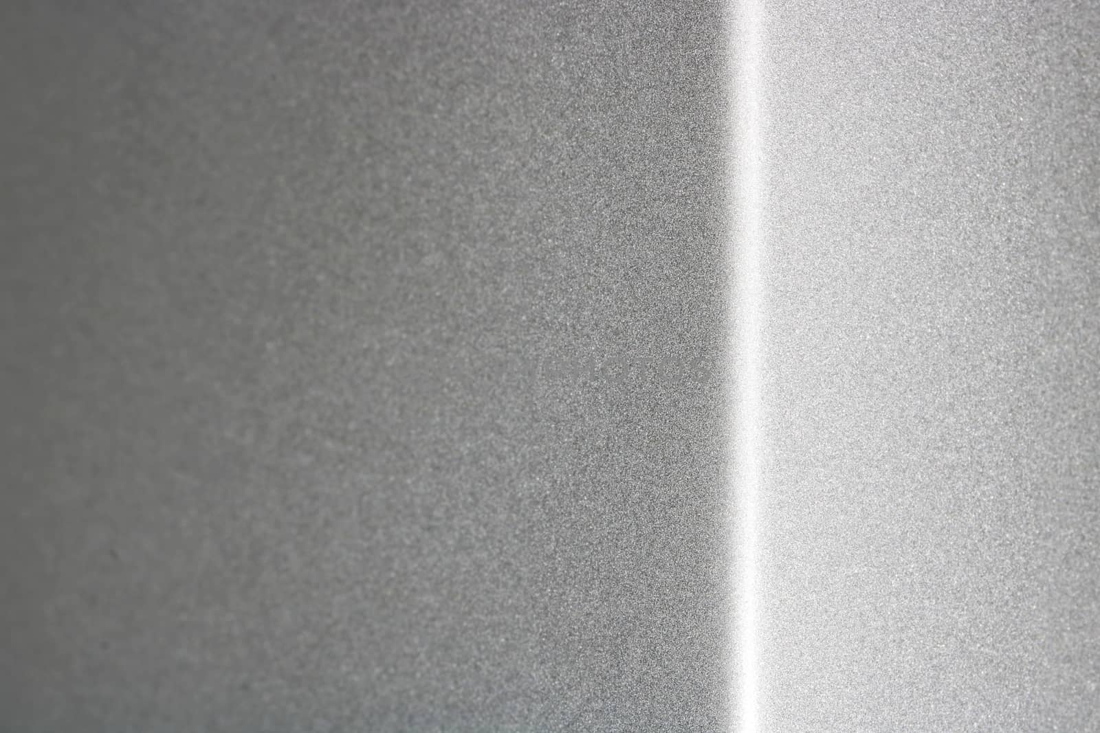 Reflection on gray metallic corner surface, selective focus