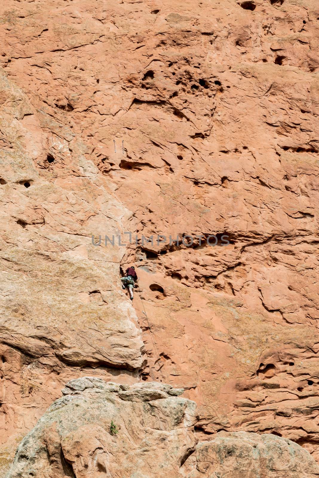 Rock-climber along Central Garden Trail in Garden of the Gods, Colorado by Njean