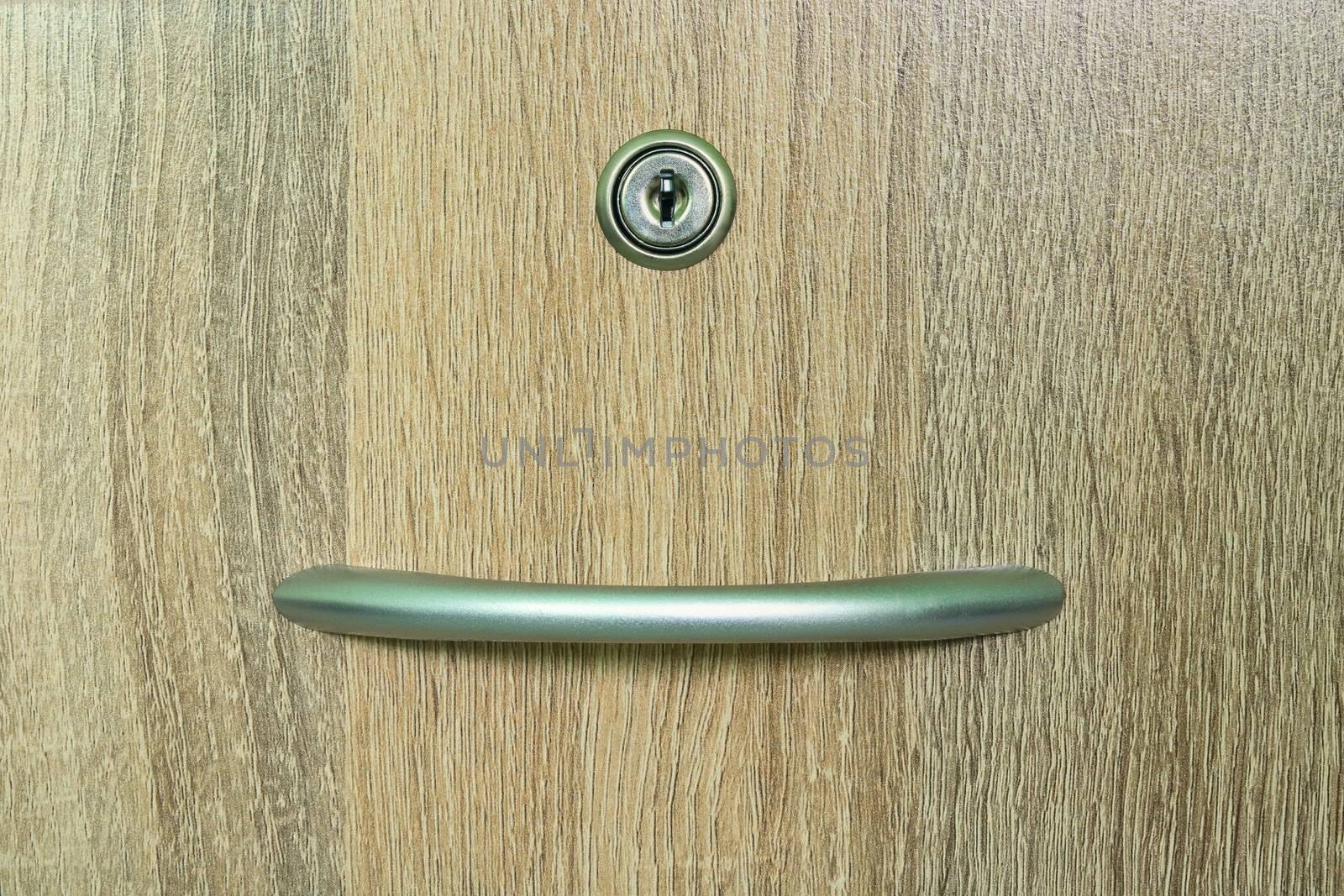 Brown wooden cabinet drawer with one keyhole