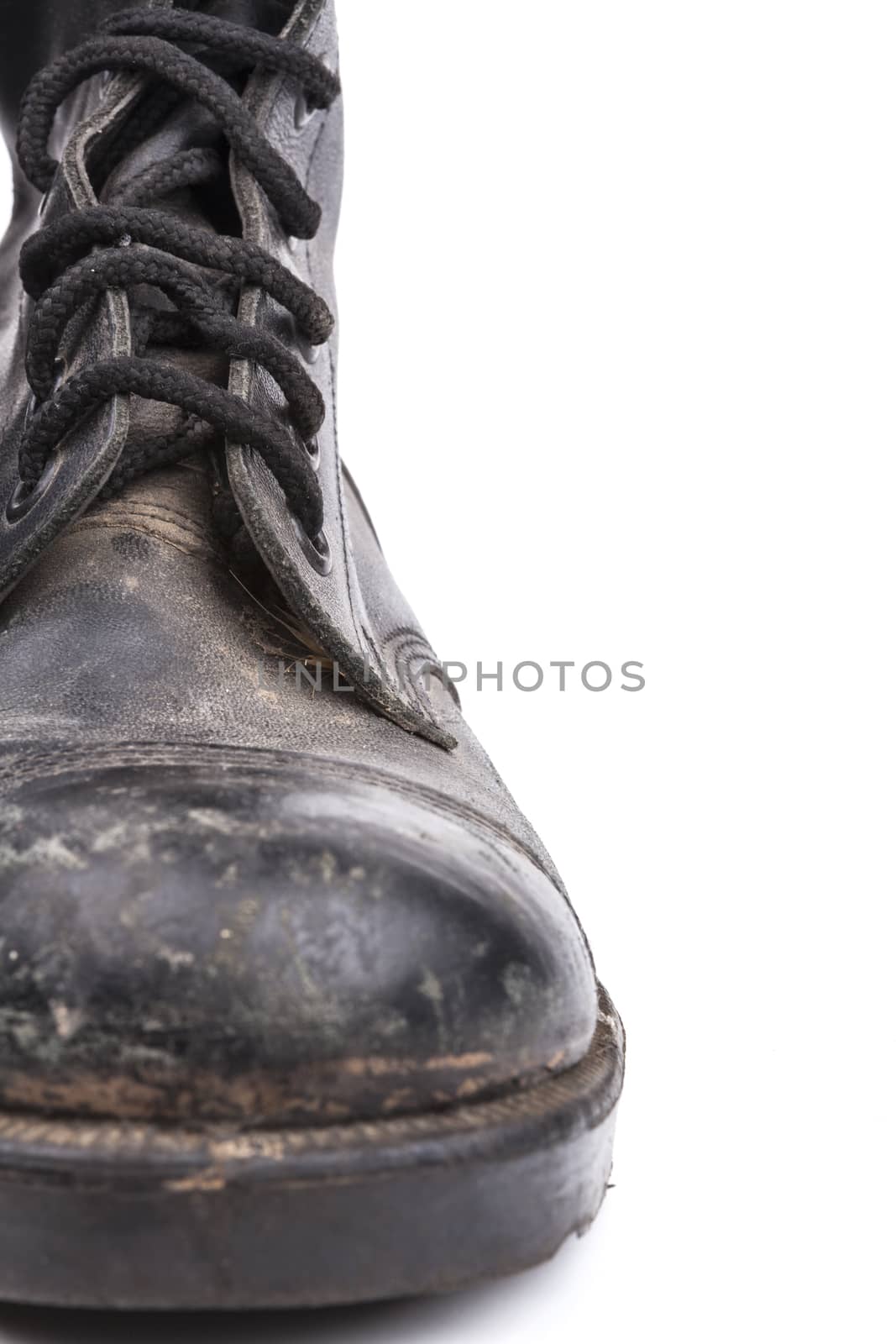 One  Black Dirty army boot isolated on white background