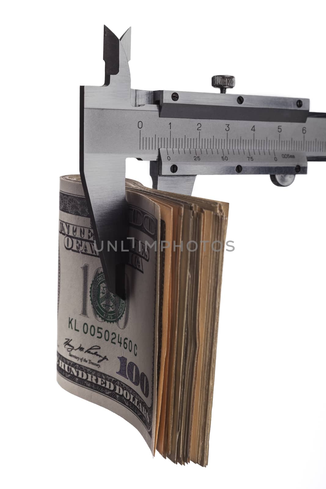 Measuring dollar banknotes with calliper isolated on white background